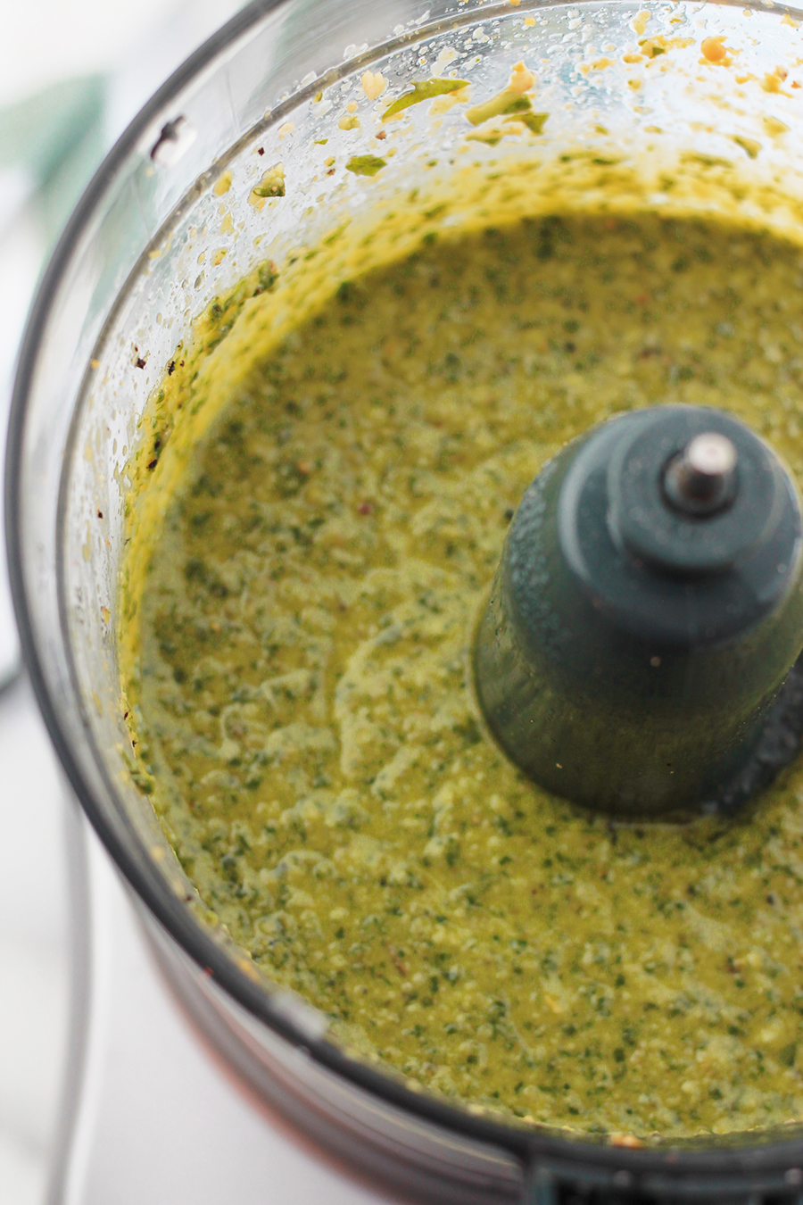 Blended vegan pesto in food processor.