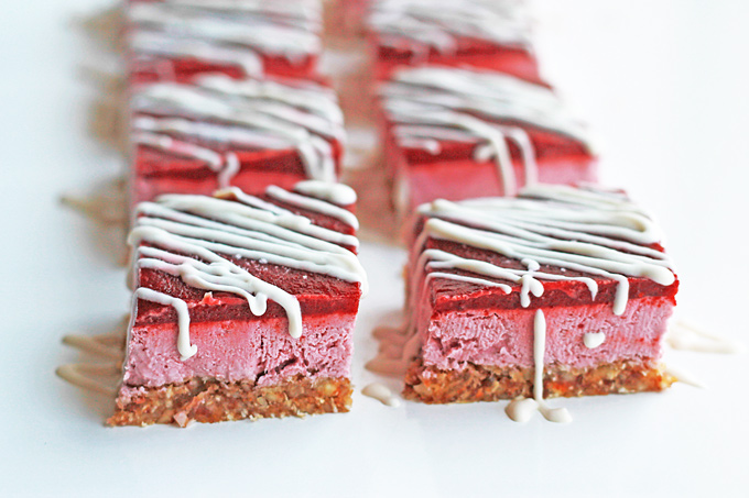 Strawberry Cherry Coconut ice bars on a white table.