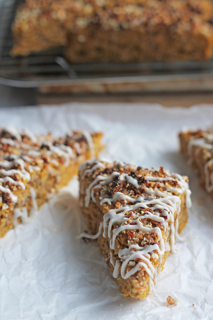 Sliced Vegan Pumpkin Date Bread drizzles with coconut cream.