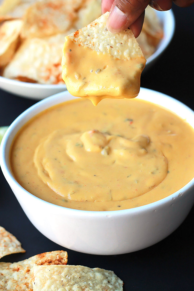 Vegan Queso with Spiced Tortilla Chips - Smooth, creamy and oh-so-delicious, you just might forget it's not real cheese.