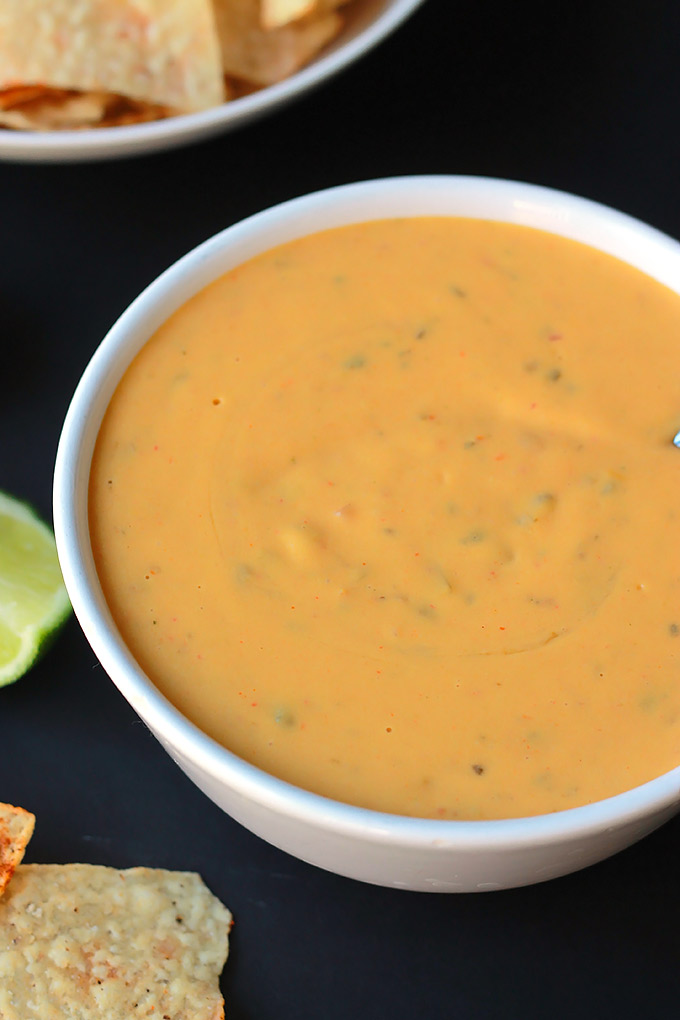 Vegan Queso with Spiced Tortilla Chips - Smooth, creamy and oh-so-delicious, you just might forget it's not real cheese.