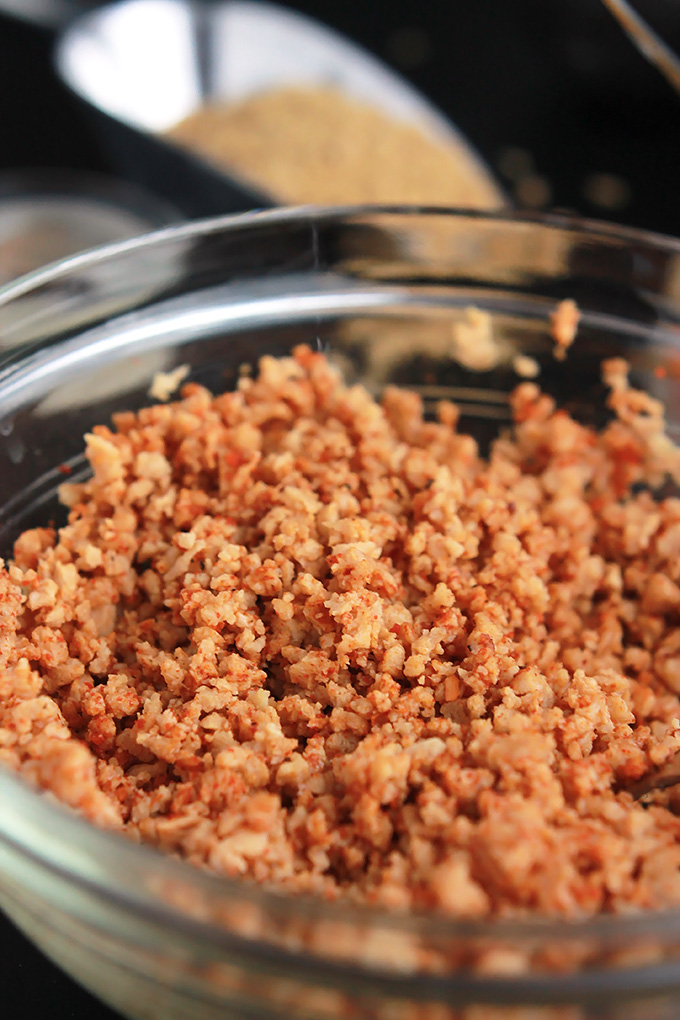 Close-up of hydrated textured vegetable protein in a glass bowl.