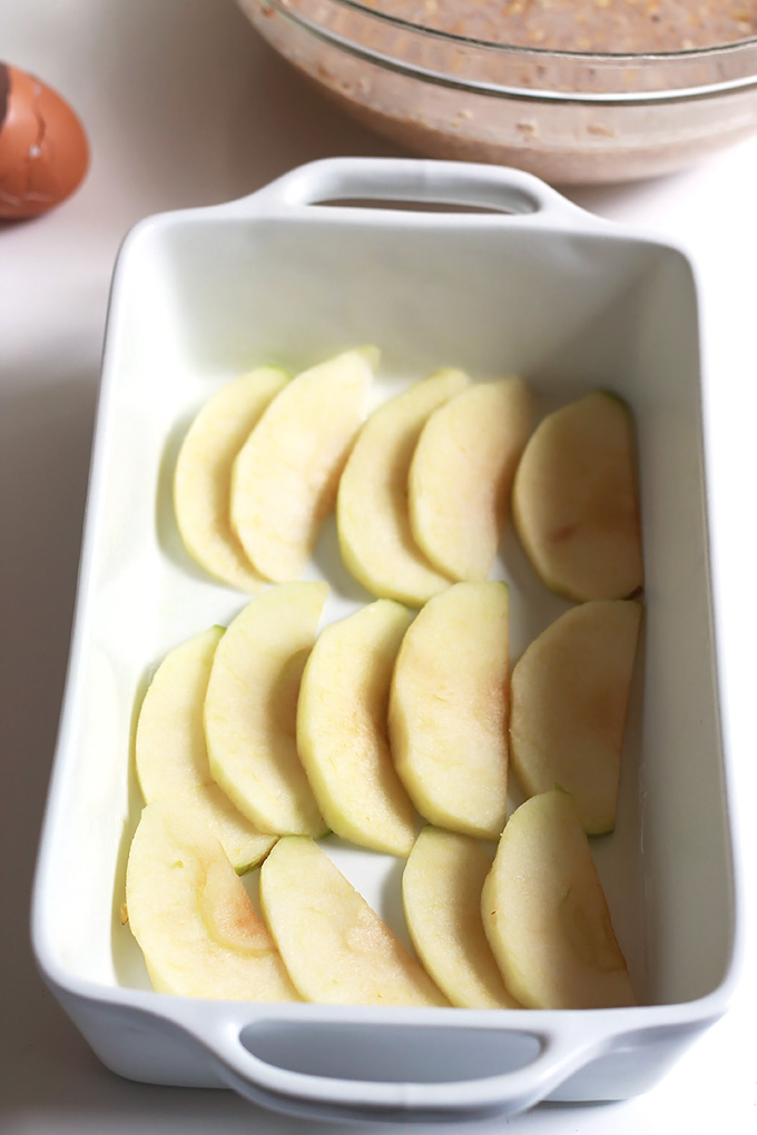 sliced apples in a baking dish.
