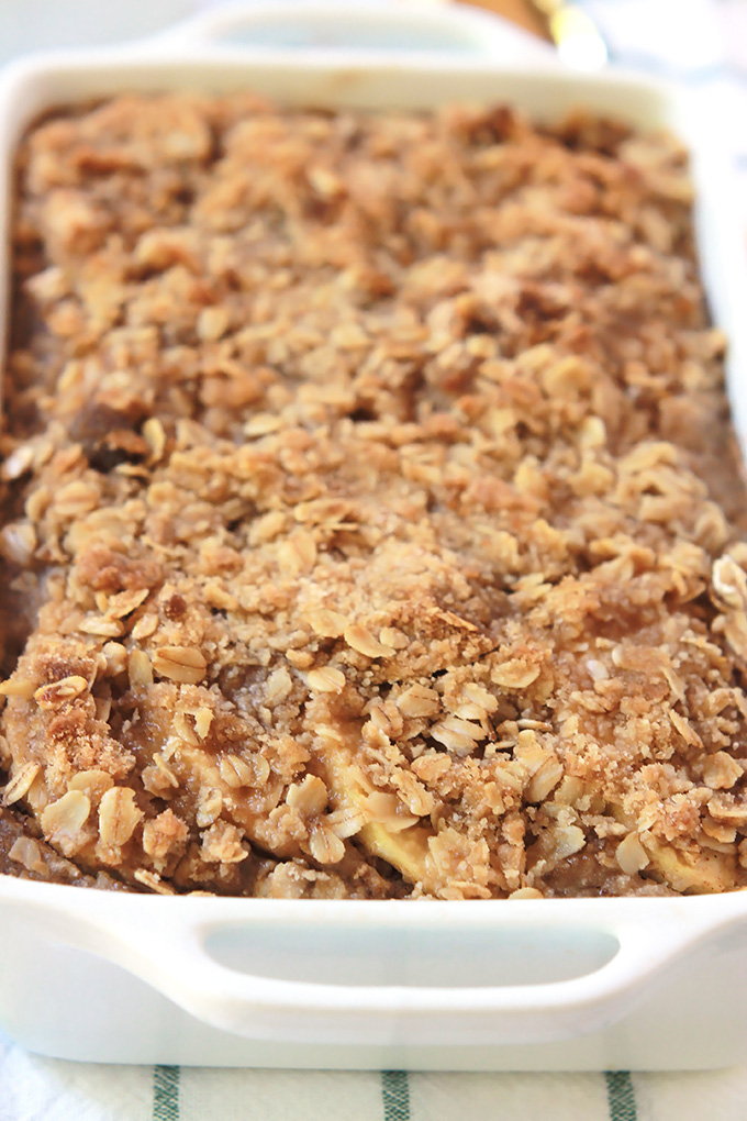Apple Cinnamon Baked Oatmeal in a white baking dish.