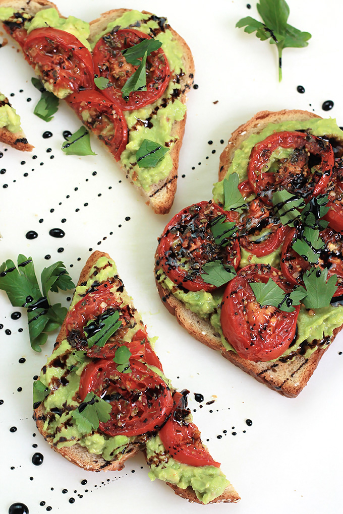 Simple, easy and delicious - Roasted Tomato Avocado Toast. Creamy Avocado mash, sweet roasted tomatoes, drizzled with balsamic glaze, it takes toast to a whole new level.