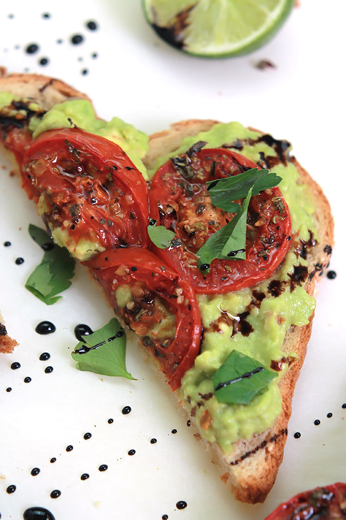 Simple, easy and delicious - Roasted Tomato Avocado Toast. Creamy Avocado mash, sweet roasted tomatoes, drizzled with balsamic glaze, it takes toast to a whole new level.