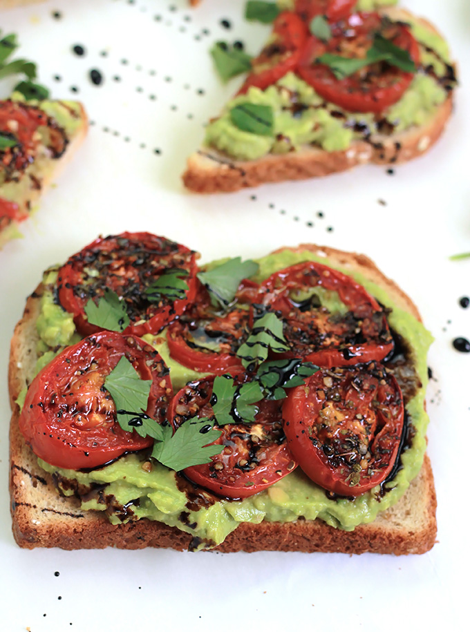 Simple, easy and delicious - Roasted Tomato Avocado Toast. Creamy Avocado mash, sweet roasted tomatoes, drizzled with balsamic glaze, it takes toast to a whole new level.