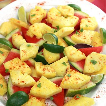 Spiced Pineapple & Watermelon - sweet juicy pineapple and watermelon slices, sprinkled with hot chili pepper and a twist of lime.What a wonderful way to spice it up!