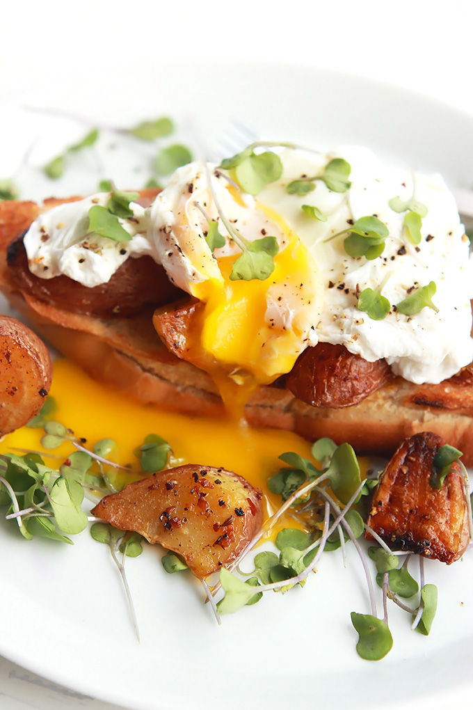 Simple poached eggs over crispy roasted gold and red tiny potatoes and toast. Perfect for a lazy Saturday or Sunday morning breakfast or brunch.