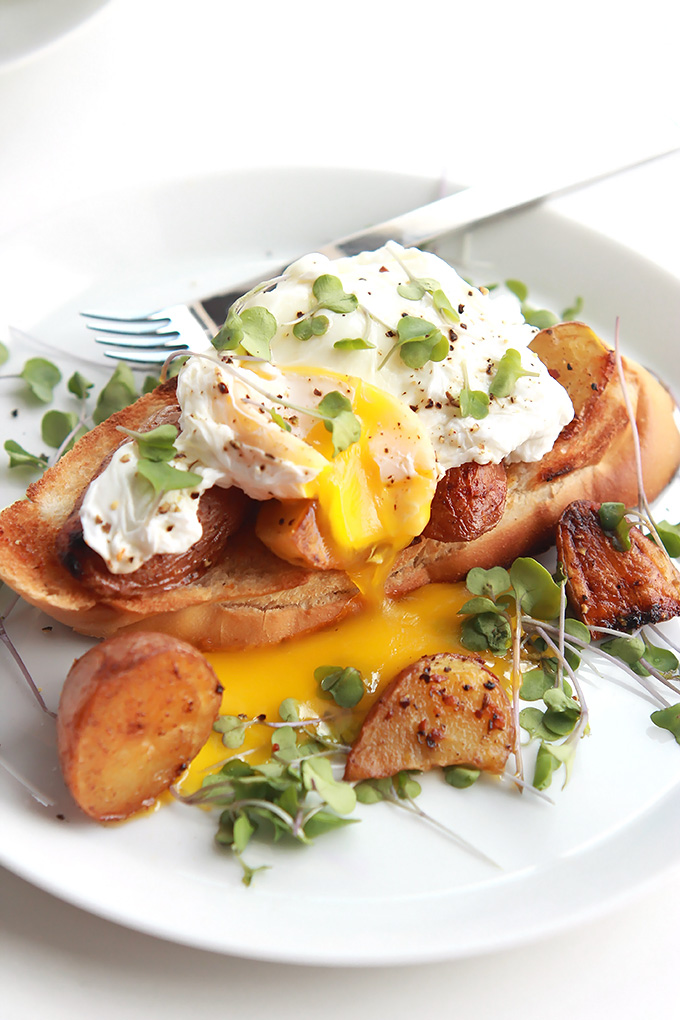Simple poached eggs over crispy roasted gold and red tiny potatoes and toast. Perfect for a lazy Saturday or Sunday morning breakfast or brunch.