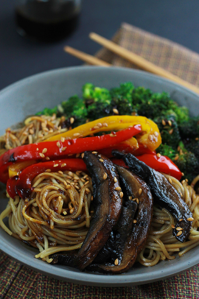 Close-up of Ramen, red and yellow peppers, mushrooms and broccoli in a bowl