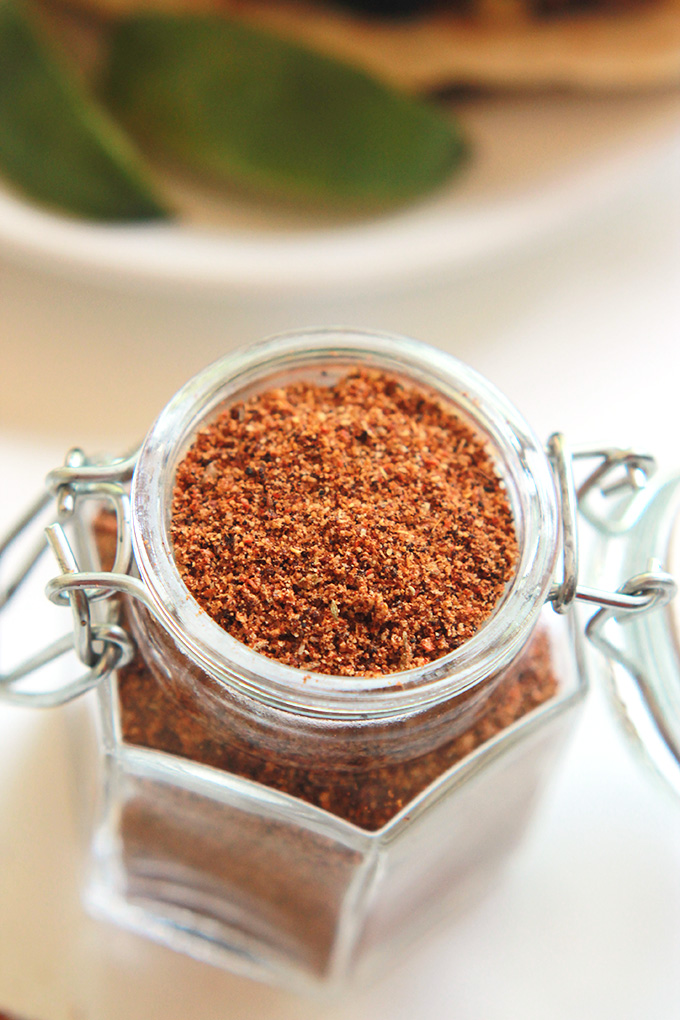 Overhead shot of DIY taco seasoning in a glass spice jar.