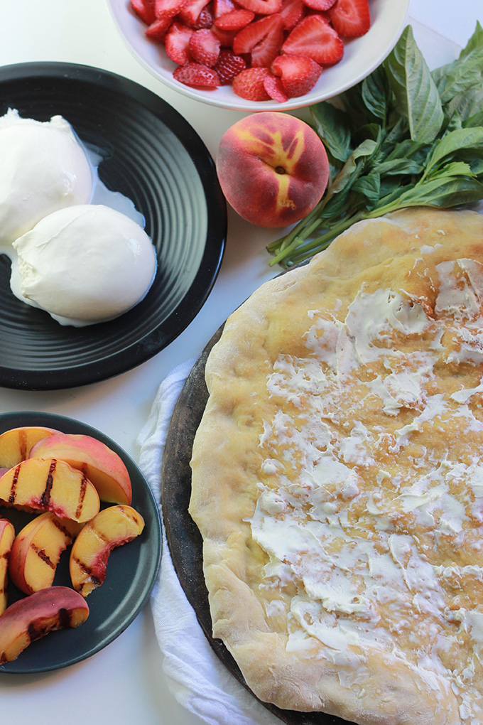 Sweet strawberries, grilled peaches and burrata cheese make this Peachy Strawberry Pizza one you'll want to make over and over .