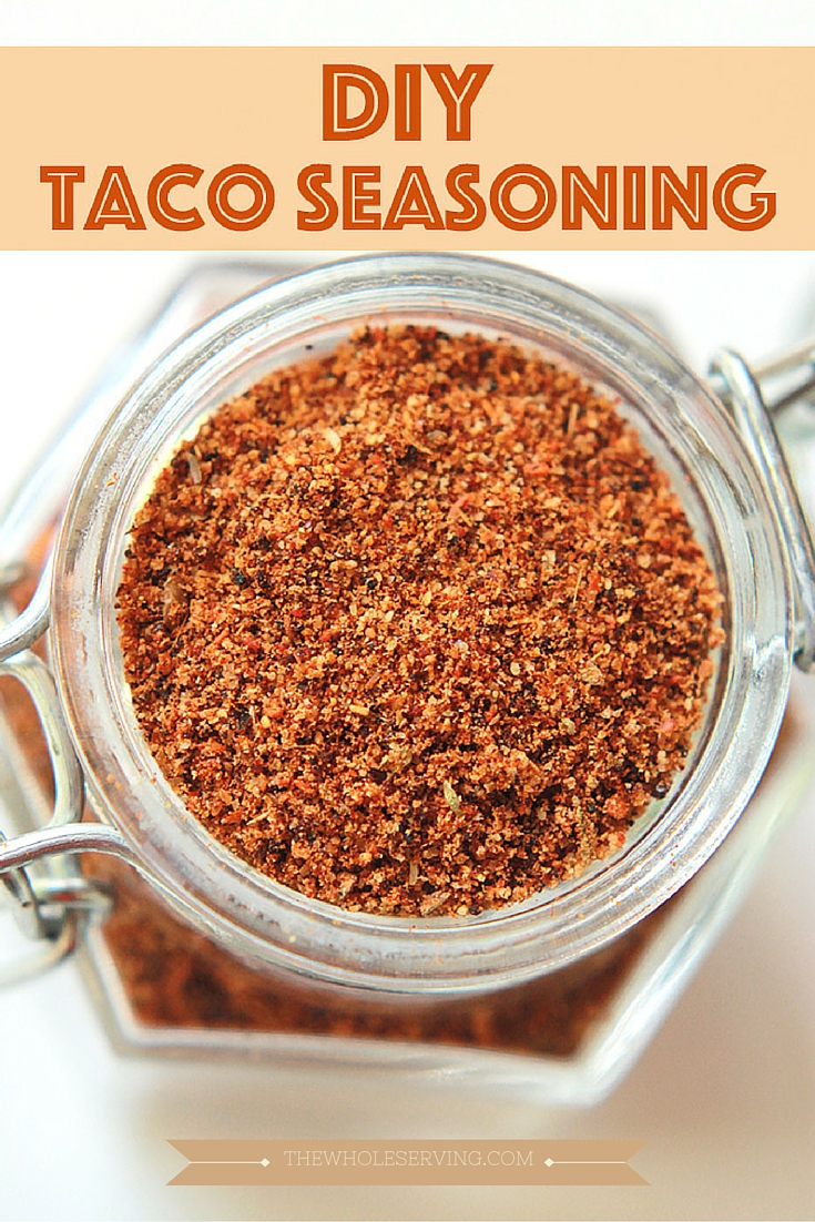 Overhead shot of DIY taco seasoning in a glass spice jar.