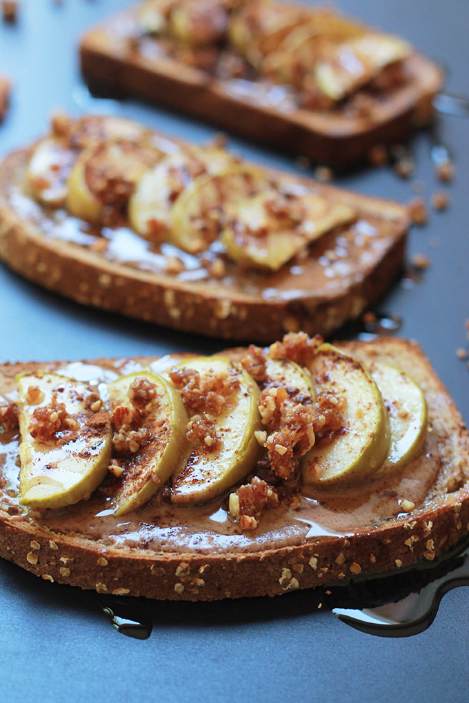 Whole wheat toast layered with almond butter, sliced apples, sprinkled with almond and date mixture, drizzled with agave nectar.