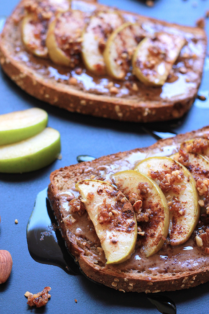 Whole wheat toast layered with almond butter, sliced apples, sprinkled with almond and date mixture.