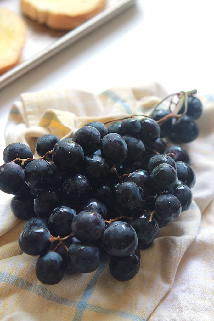 Simple and simply delicious, this Roasted Grapes with Burrata Cheese Toast recipe is perfect for those impromptu gatherings. Toast, softly melted Burrata, roasted grapes and a drizzle of agave or honey, so easy. 