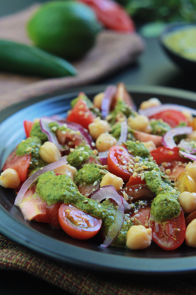 Cilantro Chutney with Heirloom Tomato Salad will amaze your tastebuds. This Cilantro Chutney is a bold and spicy Indian condiment perfect for sandwiches, snacks and so much more. Have fun exploring the possibilities.