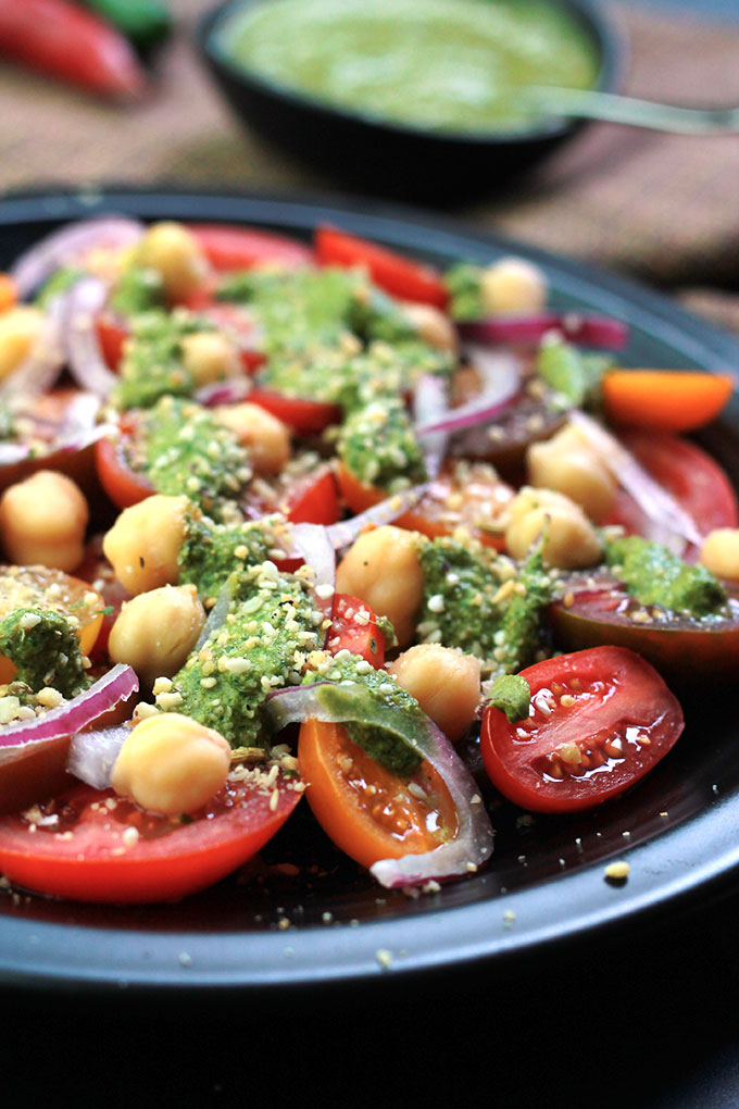 Cilantro Chutney with Heirloom Tomato Salad will amaze your tastebuds. This Cilantro Chutney is a bold and spicy Indian condiment perfect for sandwiches, snacks and so much more. Have fun exploring the possibilities.