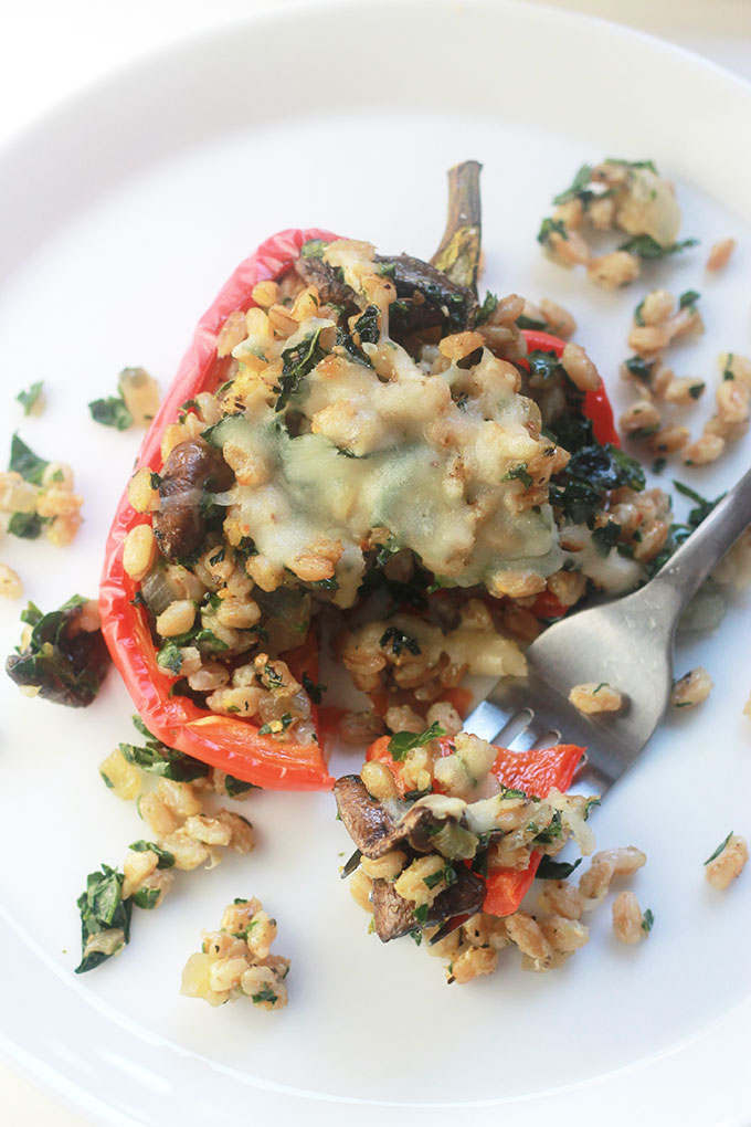 Kale & Farro Stuffed Peppers-Packed full of nutritious farro filled with protein and fiber. Perfect weeknight dinner with a large green salad.