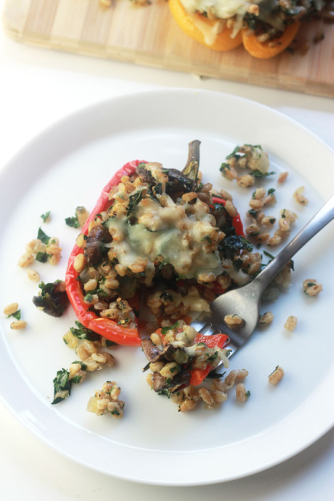 Kale & Farro Stuffed Peppers-Packed full of nutritious farro filled with protein and fiber. Perfect weeknight dinner with a large green salad.