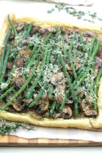 Rustic and savory Easy Mushroom Green Bean Tart. Great dish for a Black Friday brunch, perfect way to use Thanksgiving leftovers.