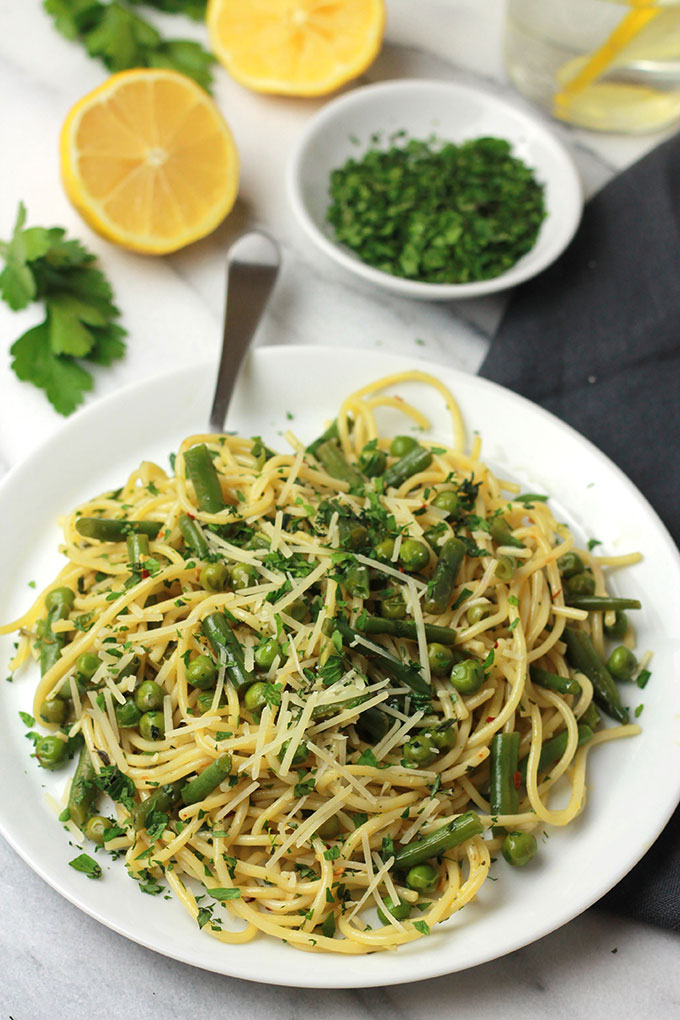 Fresh mix of herbs over crisp veggies and tender pasta finished off with a squeeze of lemon juice, this Herb Green Bean and Pea Pasta sings spring.