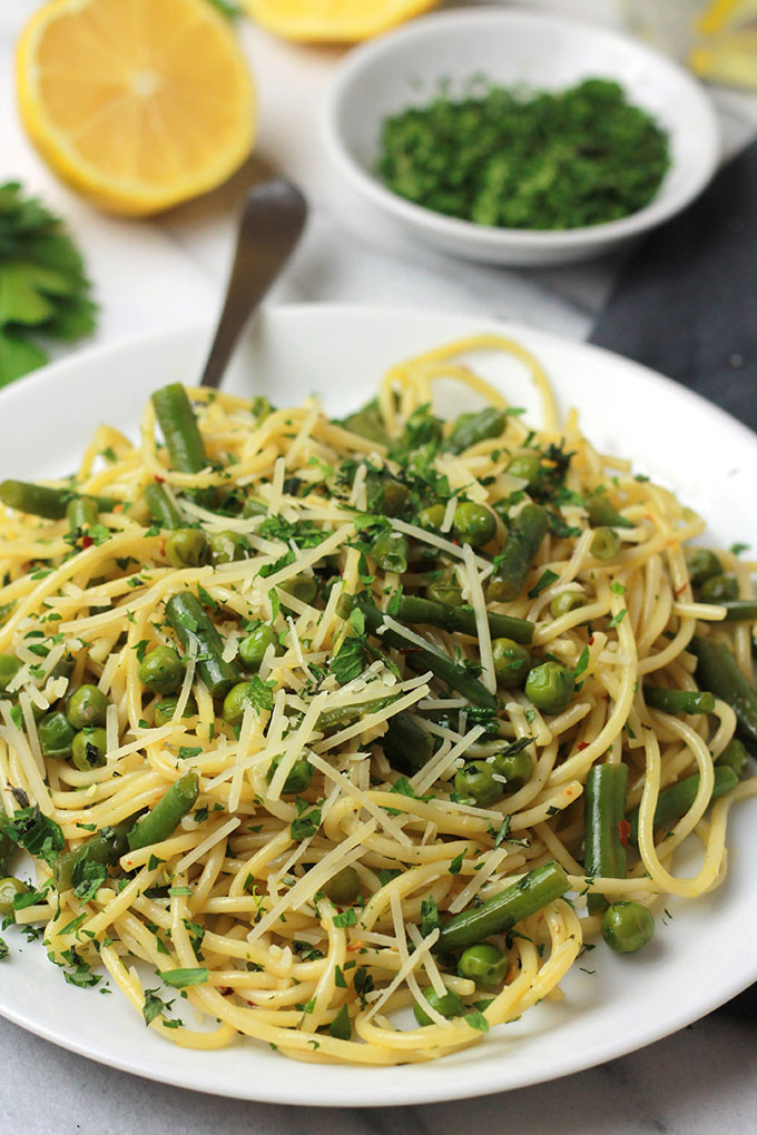 Fresh mix of herbs over crisp veggies and tender pasta finished off with a squeeze of lemon juice, this Herb Green Bean and Pea Pasta sings spring.