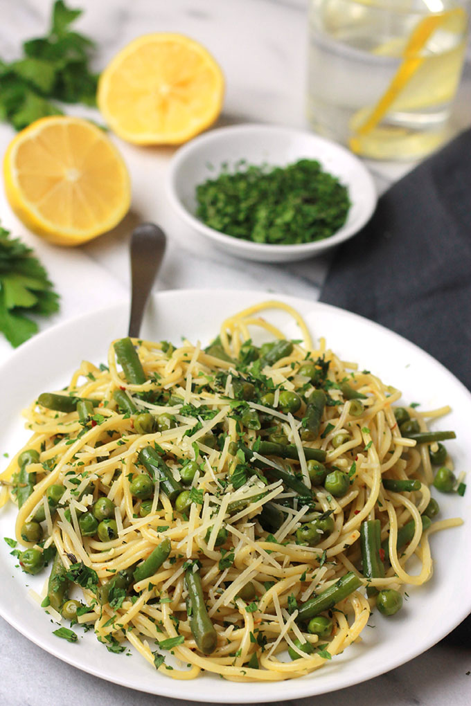 Fresh mix of herbs over crisp veggies and tender pasta finished off with a squeeze of lemon juice, this Herb Green Bean and Pea Pasta sings spring.
