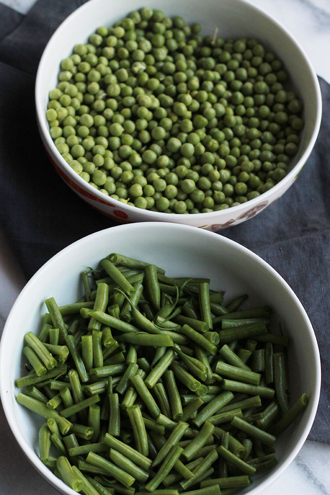 Fresh mix of herbs over crisp veggies and tender pasta finished off with a squeeze of lemon juice, this Herb Green Bean and Pea Pasta sings spring.