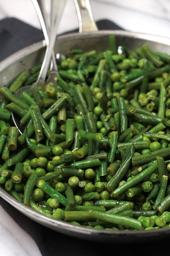 Fresh mix of herbs over crisp veggies and tender pasta finished off with a squeeze of lemon juice, this Herb Green Bean and Pea Pasta sings spring.