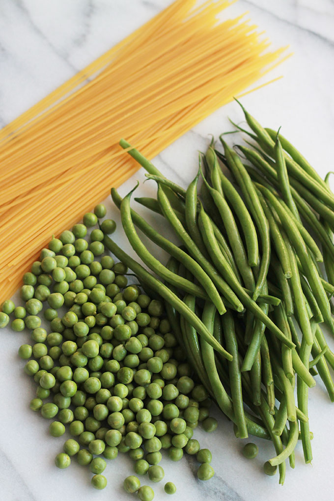 Fresh mix of herbs over crisp veggies and tender pasta finished off with a squeeze of lemon juice, this Herb Green Bean and Pea Pasta sings spring.