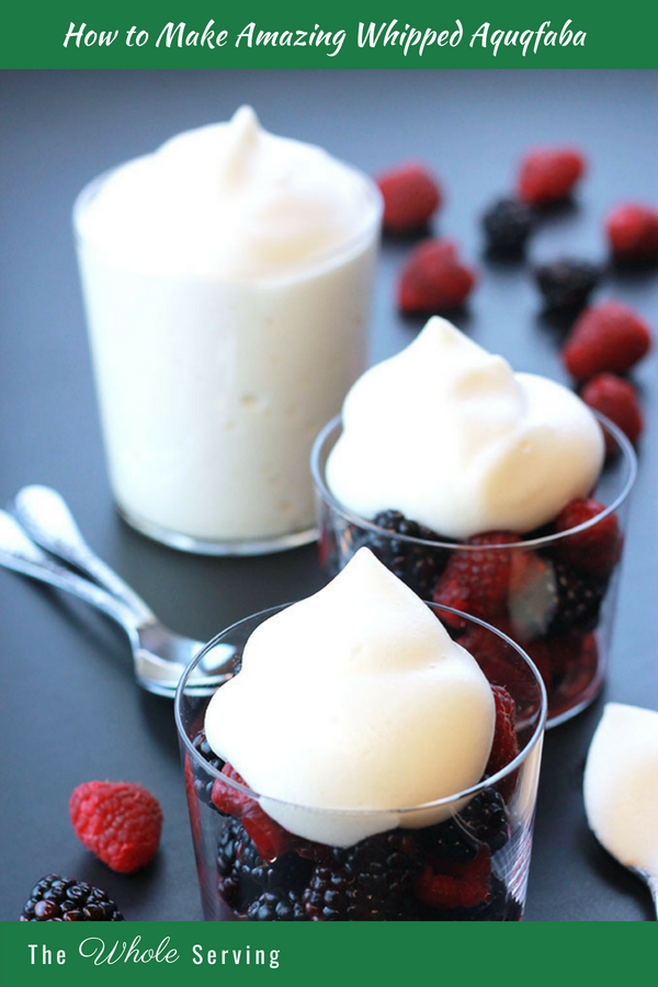 Raspberries and blackberries with whipped aquafaba on top.