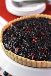 Blueberry Raspberry & Apple Tart, topped off with Wild Blueberry Sauce, amazing texture and flavor. Perfect for summer holiday gatherings.