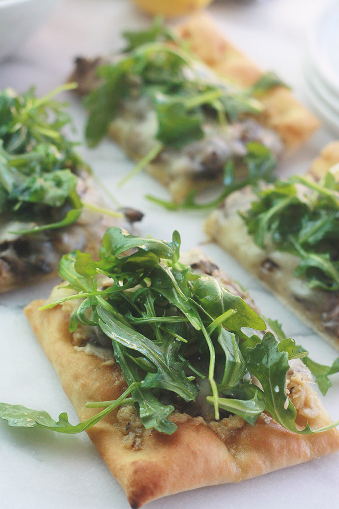 Slices of Mushroom Pizza with Artichoke Pesto and Arugula-Rich, aromatic, and filled with incredible flavor.