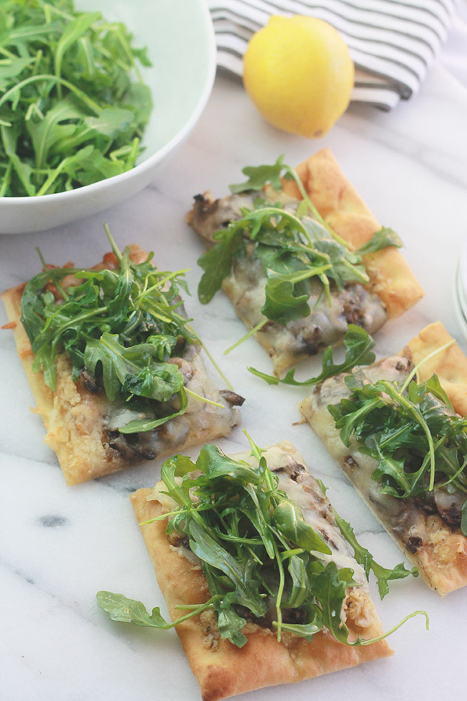 Slices of Mushroom Pizza with Artichoke Pesto and Arugula-Rich, aromatic, and filled with incredible flavor.