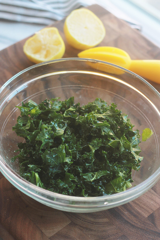 Kale with olive oil, salt and lemon for Israeli Couscous Kale Salad with Feta