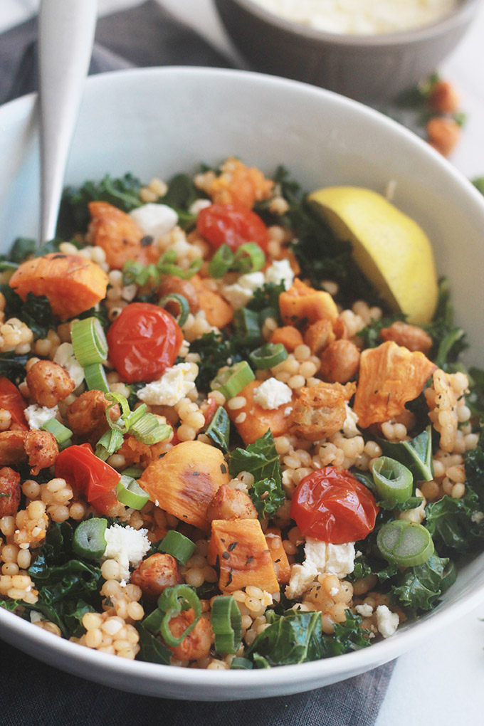 Ready for a supercharged, healthy, hearty salad?  You're going to love this Israeli Couscous Kale Salad with Feta it's made with tender Israeli Couscous, roasted tomatoes, sweet potatoes and chickpeas tossed with seasoned fresh kale.