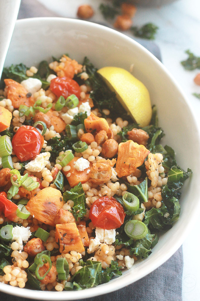 Ready for a supercharged, healthy, hearty salad?  You're going to love this Israeli Couscous Kale Salad with Feta it's made with tender Israeli Couscous, roasted tomatoes, sweet potatoes and chickpeas tossed with seasoned fresh kale.