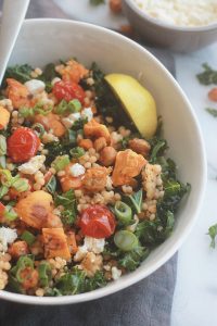 Ready for a supercharged, healthy, hearty salad?  You're going to love this salad made with tender Israeli Couscous, roasted tomatoes, sweet potatoes and chickpeas tossed with seasoned fresh kale.