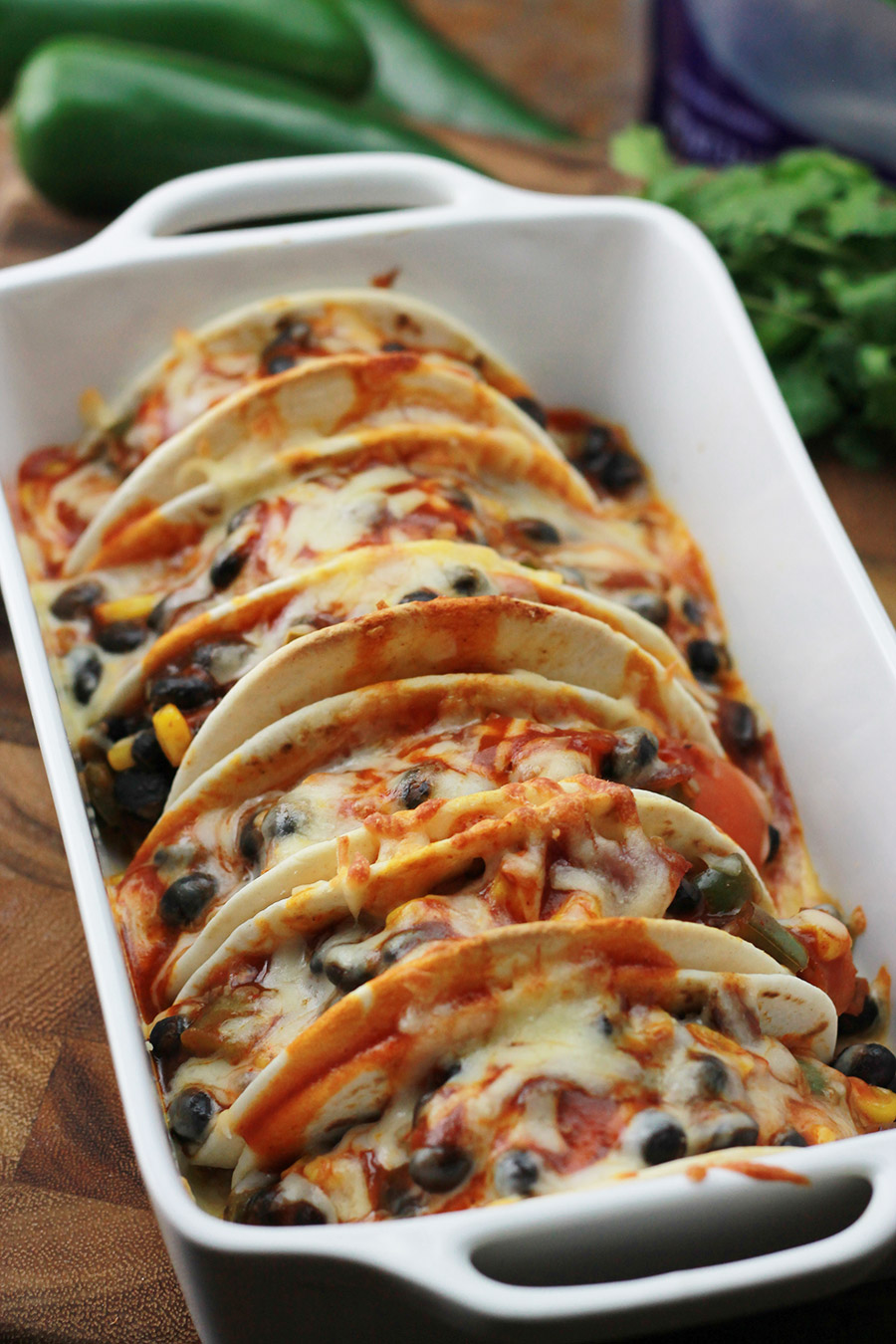  Baked Black Bean Tacos with Red Chile Sauce in baking dish.