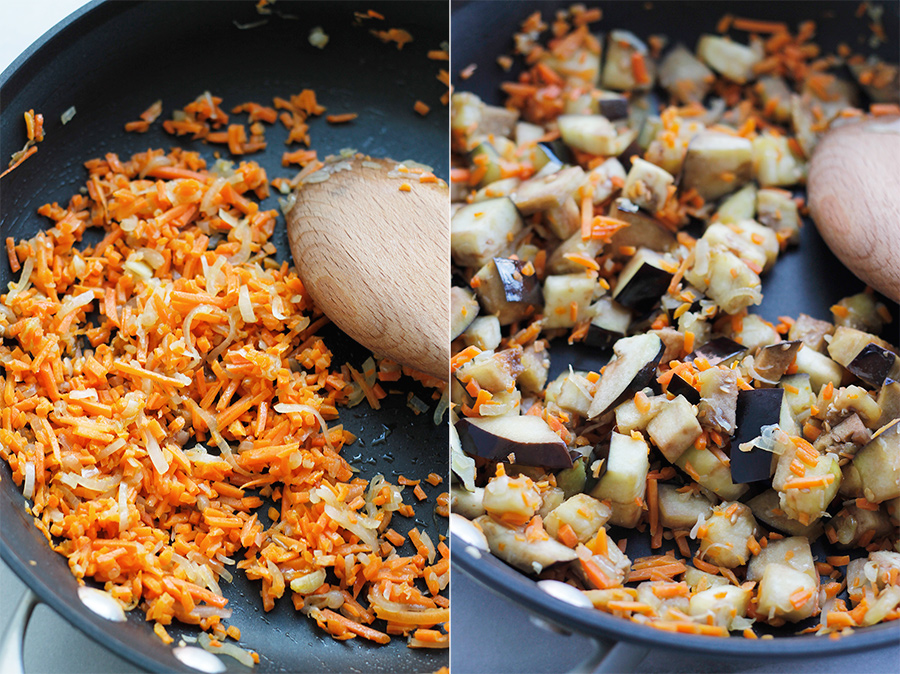 Sauteed shallots and carrots and diced eggplant in saute pan.