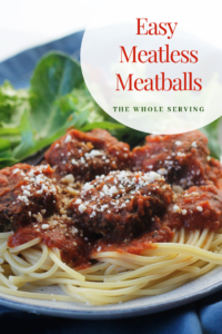 Easy Meatless Meatballs and pasta on a plate with salad.