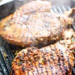 Grilled chicken breast on grill pan.