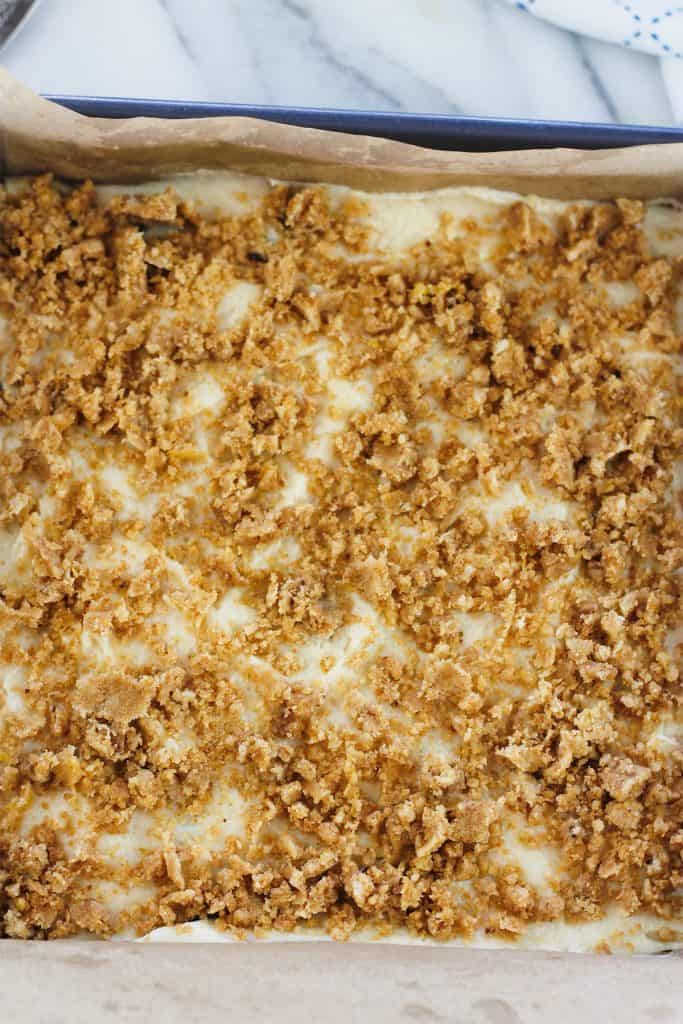 Crumb topping sprinkled over the top of unbaked crumb cake.