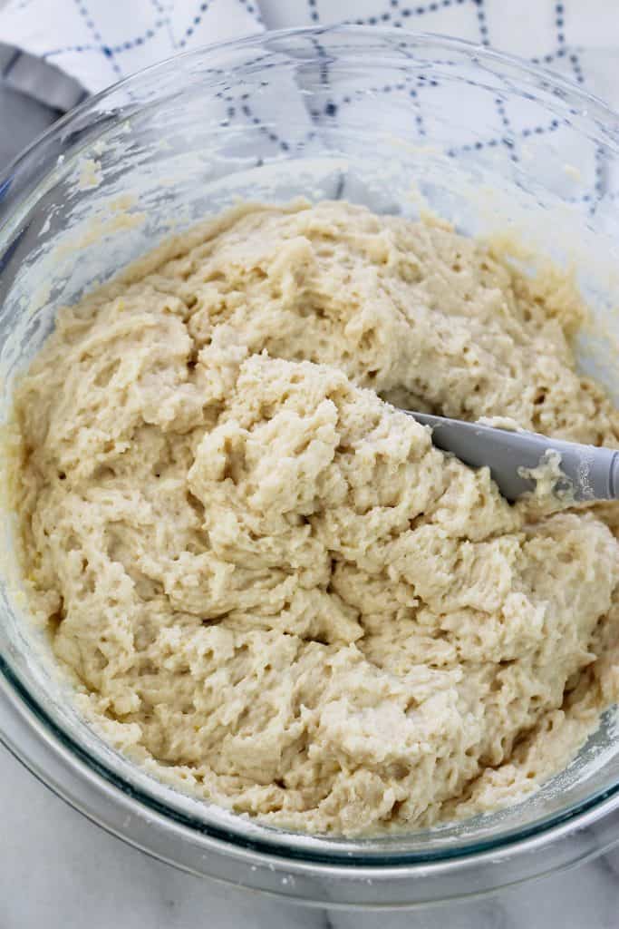 Overhead shot of crumb cake batter in a glass bowl.