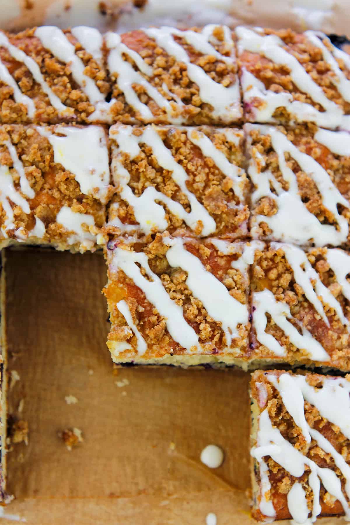 Overhead shot of lemon blueberry crumb cake cut in squares.