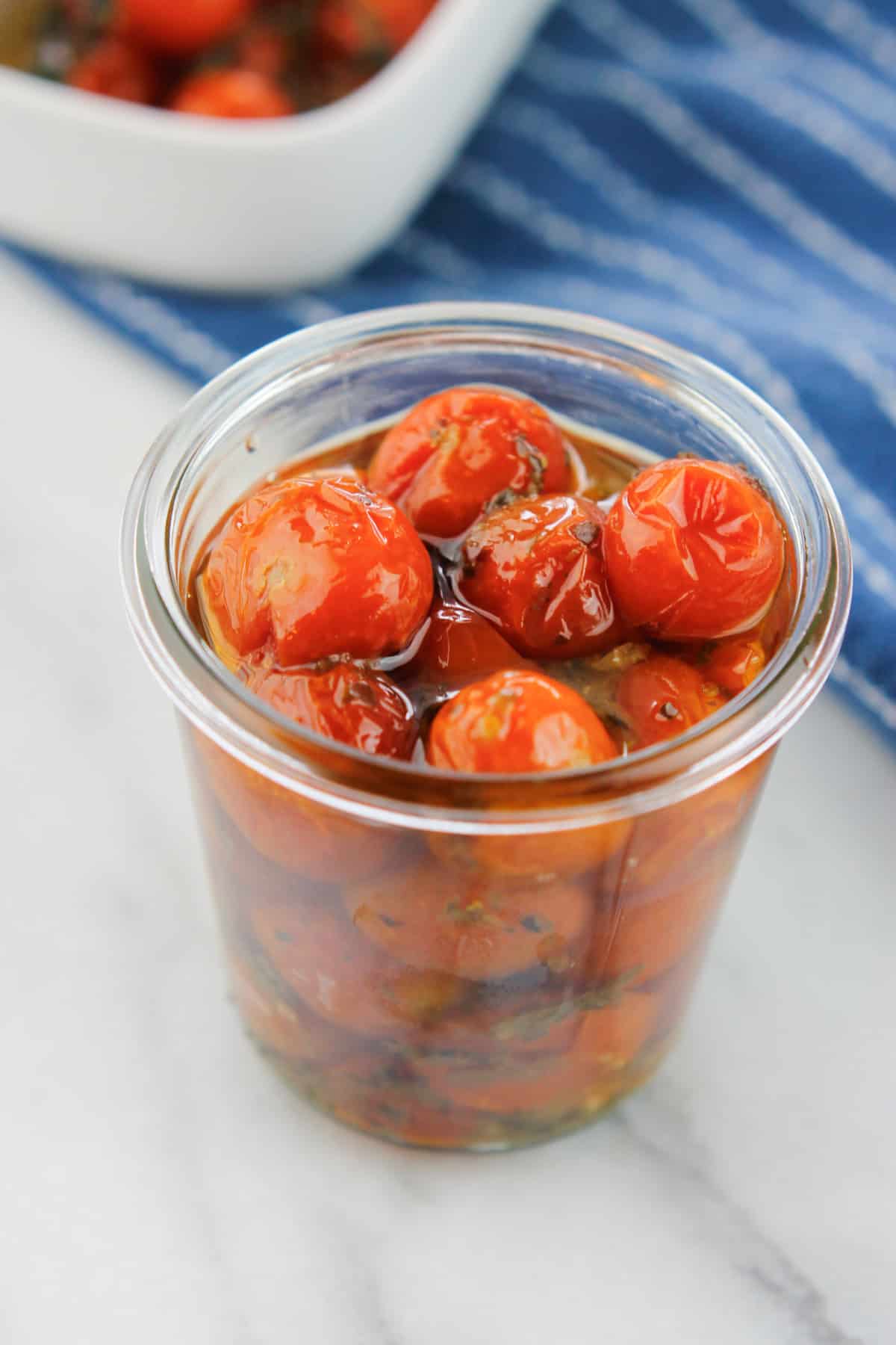 Roasted tomatoes in glass storage jar