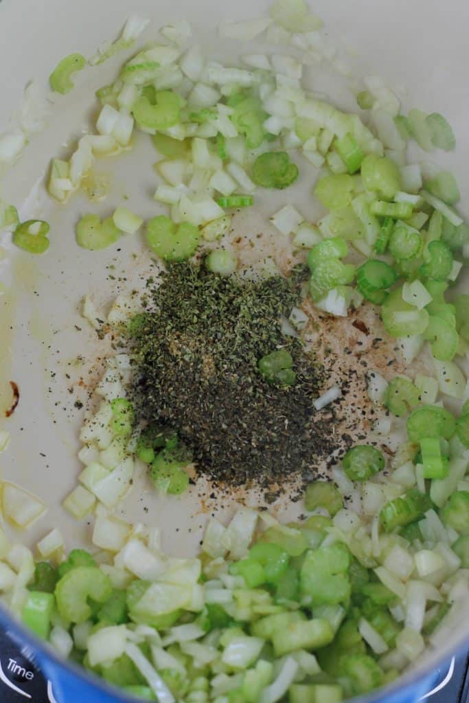 Dried herbs and spices added to the pot with the onions and celery.