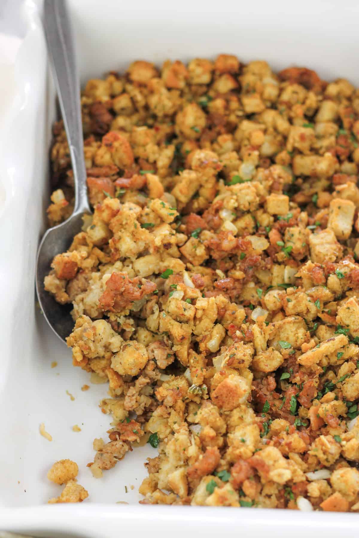 Baked Italian-Inspired sausage stuffing in baking dish.